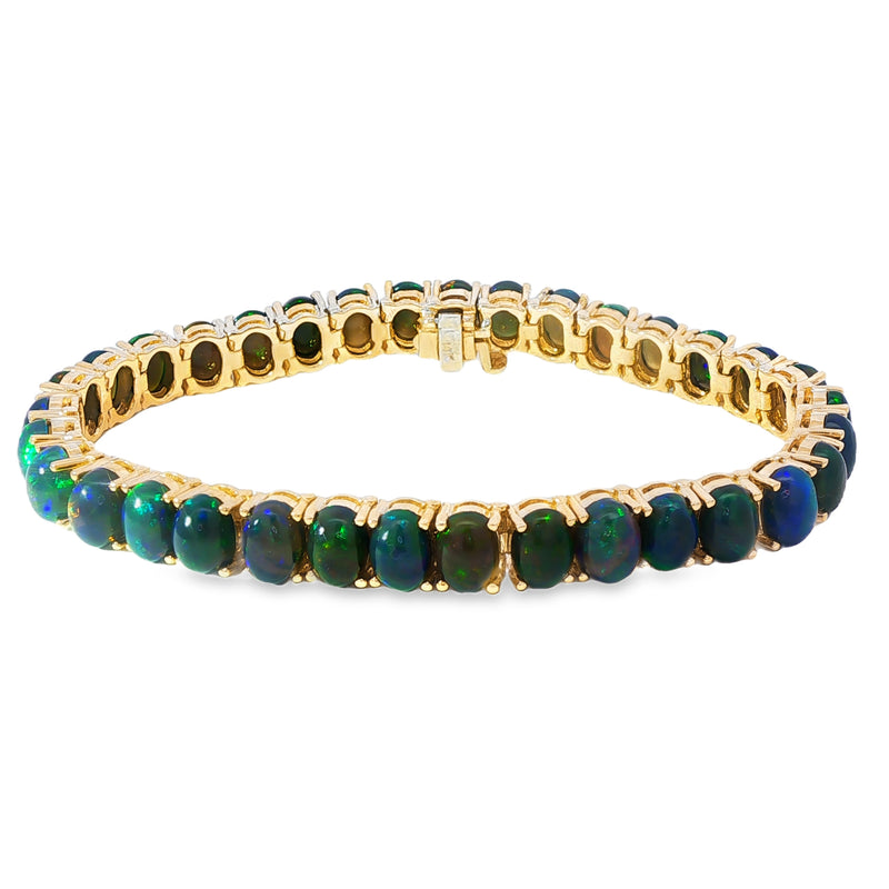 Yellow gold tennis bracelet with oval black opal gemstones in a continuous setting.