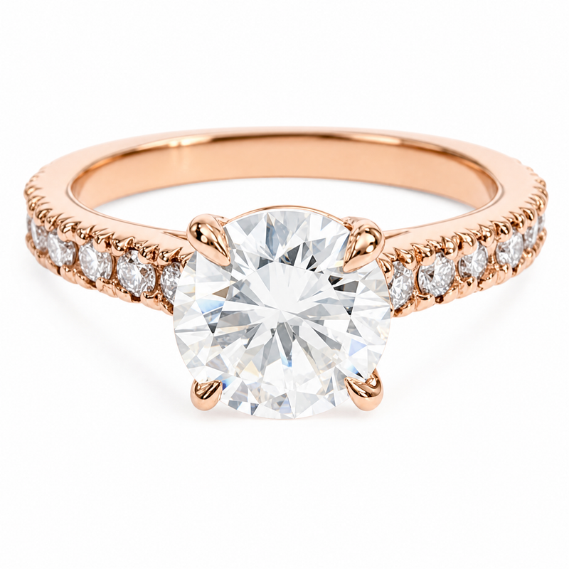 Round diamond engagement ring in yellow gold – four-prong solitaire with round accent stones along the band