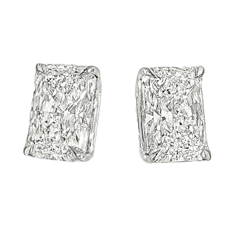 Pair of radiant cut diamond stud earrings with four-prong white gold setting, brilliant facets