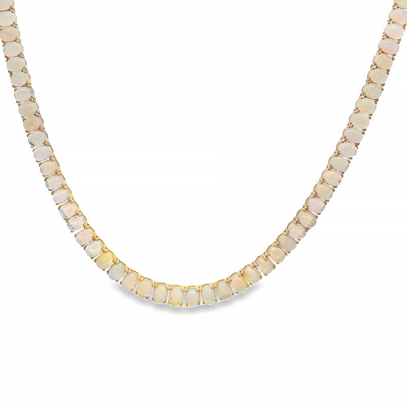 Yellow gold opal chain necklace with square links and subtle gemstone inlays.