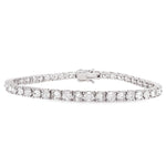 White gold tennis bracelet with alternating upside down round diamonds in a sleek setting.