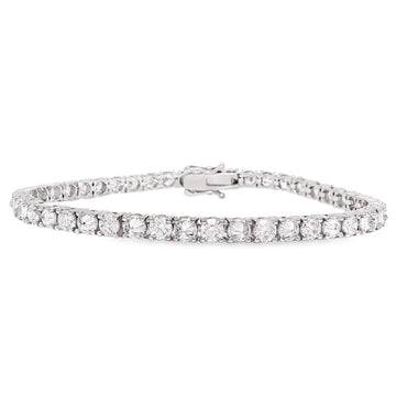 White gold tennis bracelet with alternating upside down round diamonds in a sleek setting.