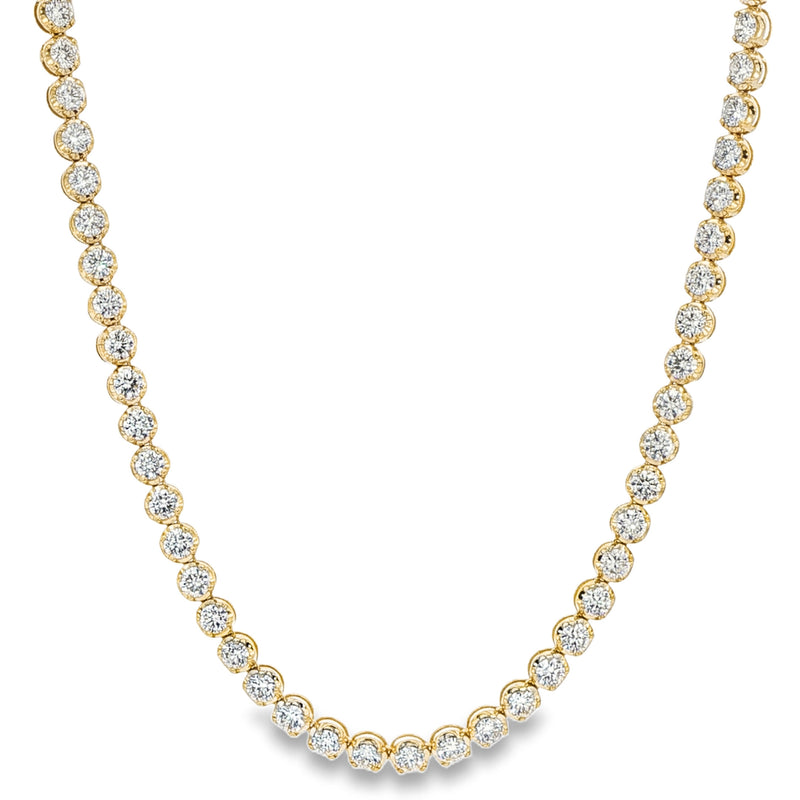 Yellow gold tennis chain necklace with round sparkling diamonds in a classic setting.