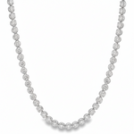 Yellow gold tennis chain necklace with round sparkling diamonds in a classic setting.