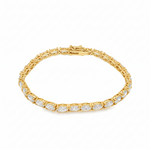White gold tennis bracelet with oval-cut diamonds in a linked setting.