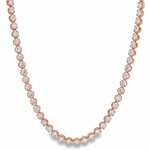 Yellow gold tennis chain necklace with round sparkling diamonds in a classic setting.