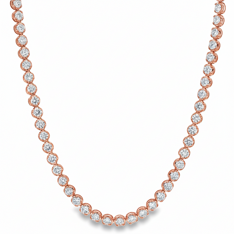 Yellow gold tennis chain necklace with round sparkling diamonds in a classic setting.