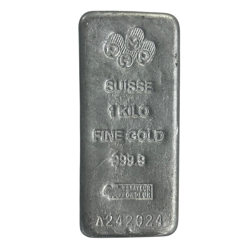 Rectangular silver aluminum bar with stamped serial number and purity markings.