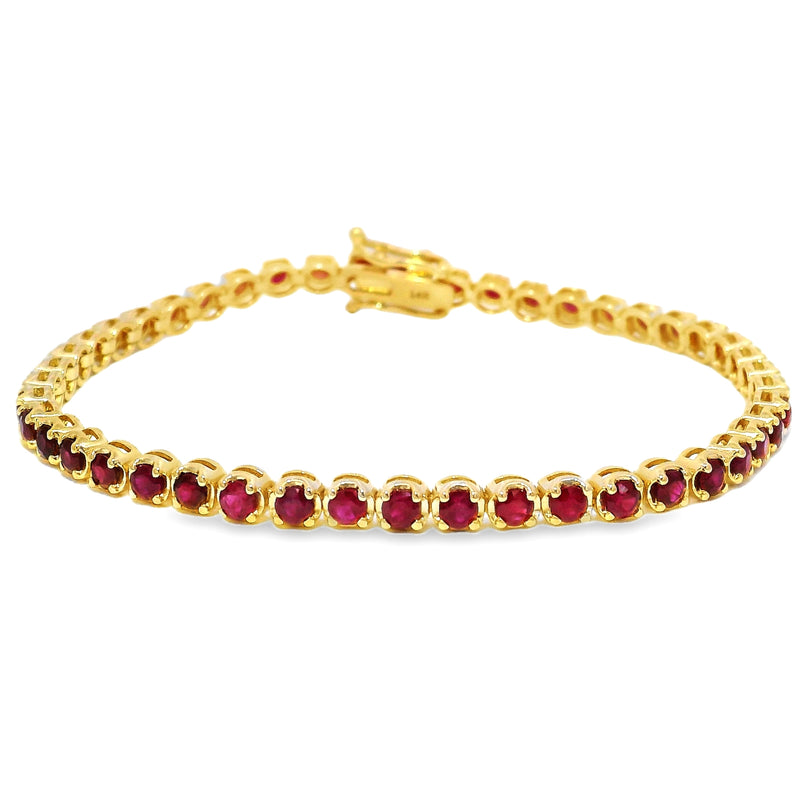 Yellow gold tennis bracelet with round ruby gemstones and secure clasp closure.