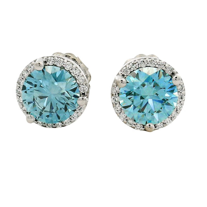 Round blue gemstone stud earrings with diamond halo in white gold setting.