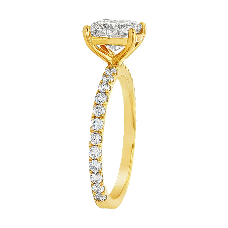 Yellow gold engagement ring with pavé diamond band and flower-inspired diamond cluster setting.