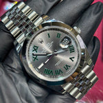Rolex DateJust 41mm Oystersteel with silver dial, green Roman numerals, and Jubilee bracelet.