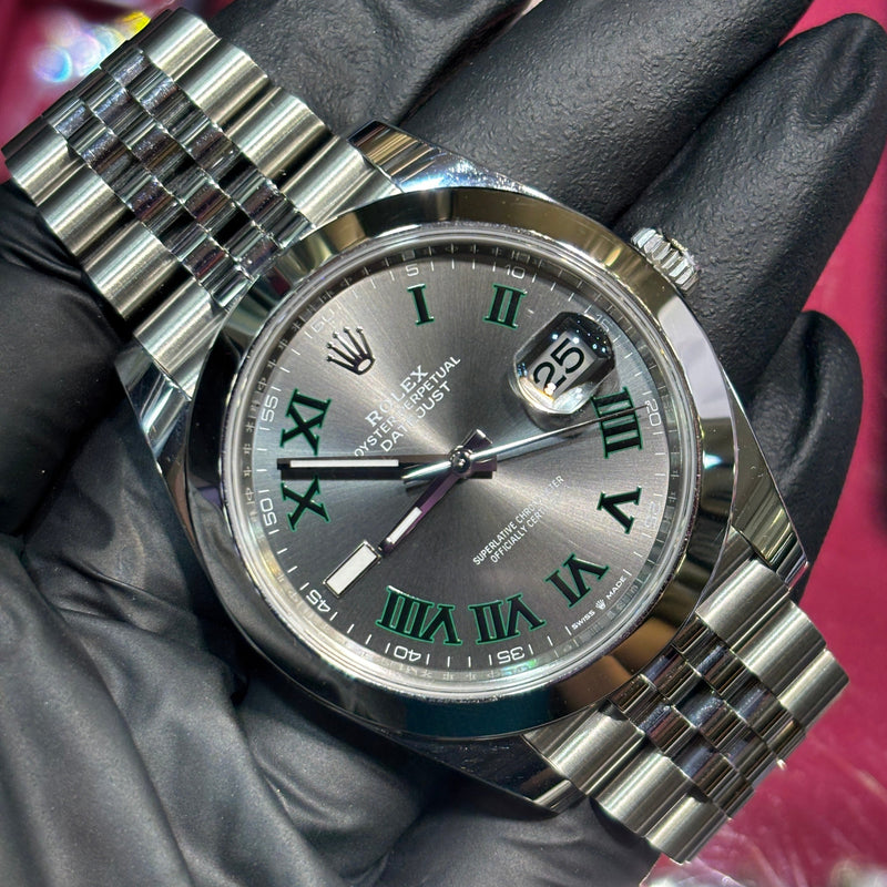 Rolex DateJust 41mm Oystersteel with silver dial, green Roman numerals, and Jubilee bracelet.
