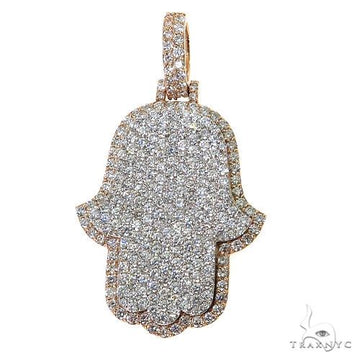 Two-tone diamond-studded Hamsa pendant with sparkling pave setting and rose gold edges.