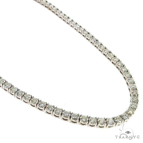 Diamond tennis chain in 14k yellow gold – round-cut stones set across full length, flat lay view