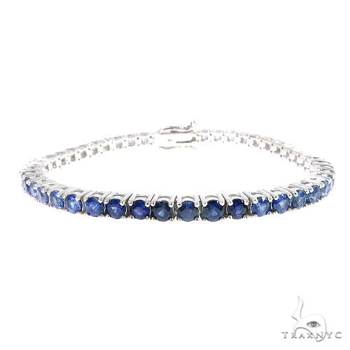 White gold tennis bracelet with 20 round blue sapphire gemstones, secure clasp closure