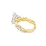 Marquise diamond engagement ring in yellow gold with intricate side diamond accents.