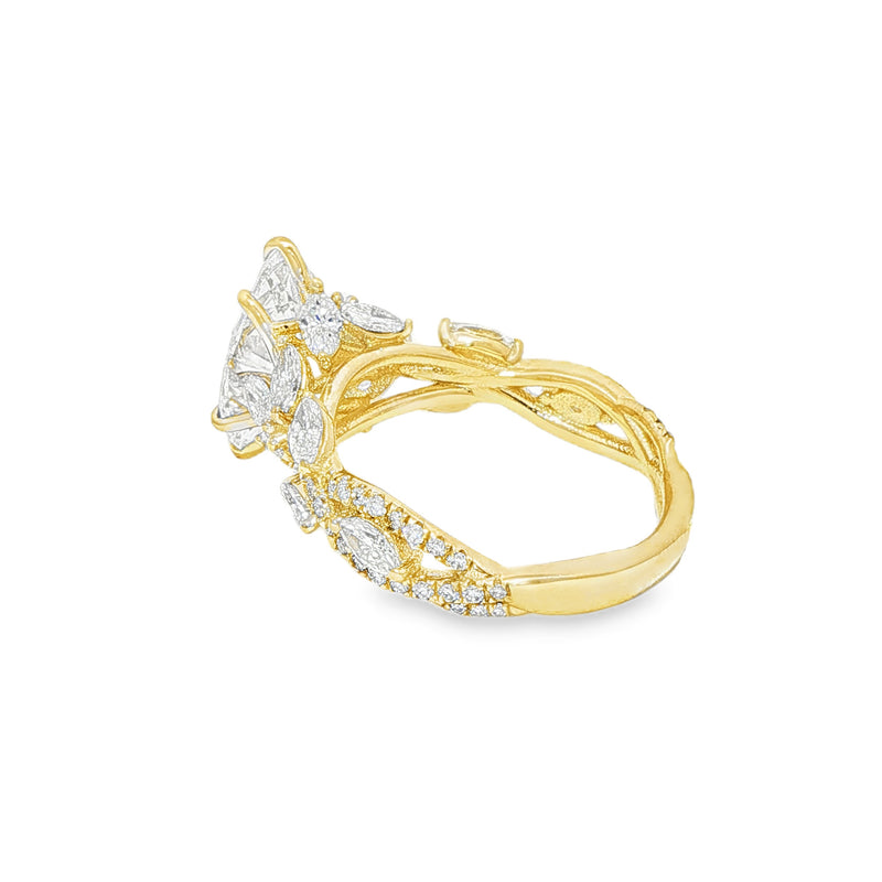 Marquise diamond engagement ring in yellow gold with intricate side diamond accents.