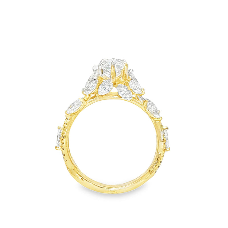 Marquise diamond engagement ring in yellow gold with intricate side diamond accents.