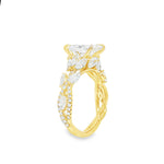 Marquise diamond engagement ring in yellow gold with intricate side diamond accents.