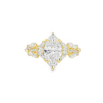 Marquise diamond engagement ring in yellow gold with intricate side diamond accents.