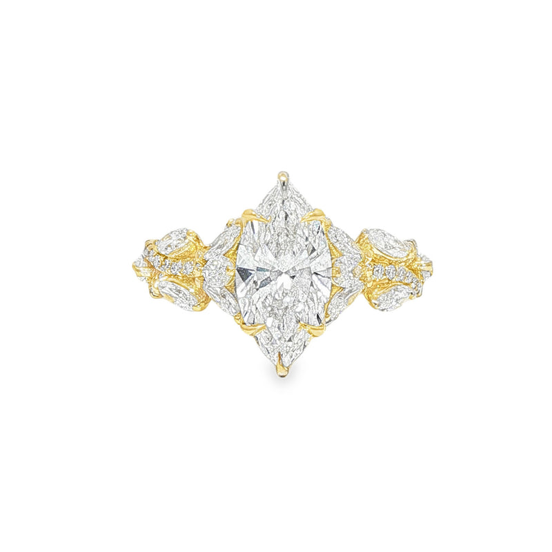 Marquise diamond engagement ring in yellow gold with intricate side diamond accents.