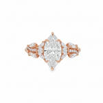 Marquise diamond engagement ring in yellow gold with intricate side diamond accents.