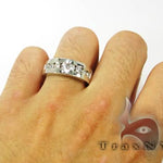 Silver men's wedding band with 8 channel-set round diamonds in a polished finish.