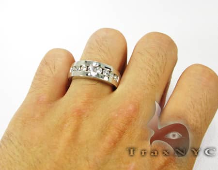 Silver men's wedding band with 8 channel-set round diamonds in a polished finish.