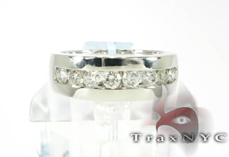 Silver men's wedding band with 8 channel-set round diamonds in a polished finish.