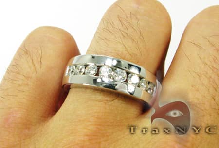 Silver men's wedding band with 8 channel-set round diamonds in a polished finish.