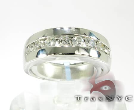 Silver men's wedding band with 8 channel-set round diamonds in a polished finish.