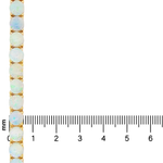 Gold chain with round opal gemstones set evenly along its length, next to a millimeter ruler for scale.
