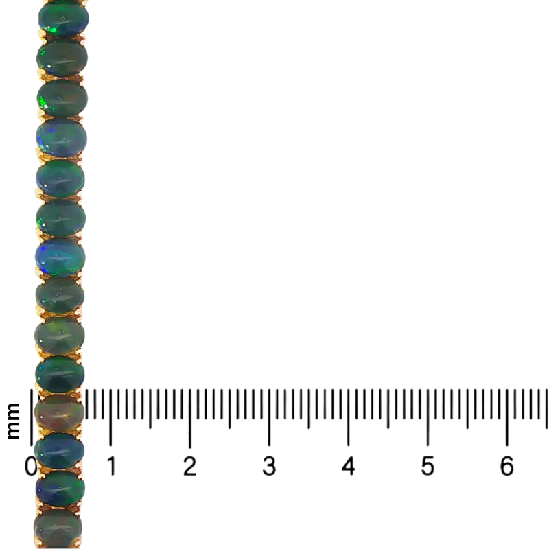 Gold tennis bracelet with oval black opal gemstones and secure clasp, shown with millimeter scale.