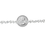 White gold diamond tennis chain with multi-shaped stones in a continuous link design.