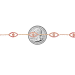 Rose gold evil eye bracelet with pink diamonds and delicate chain links.