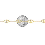 Gold bracelet with evil eye motifs adorned with yellow diamonds and clear stones.