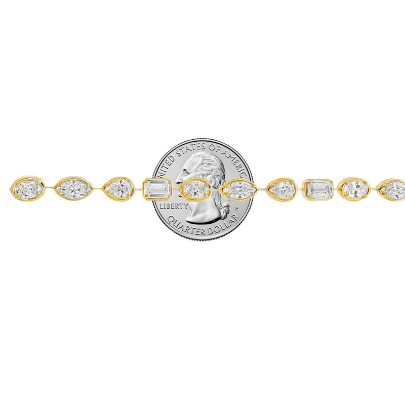 Yellow gold tennis bracelet featuring multi-shape sparkling diamonds in assorted cuts.