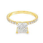 Yellow gold engagement ring with flower-cut square diamond and side diamonds on band.