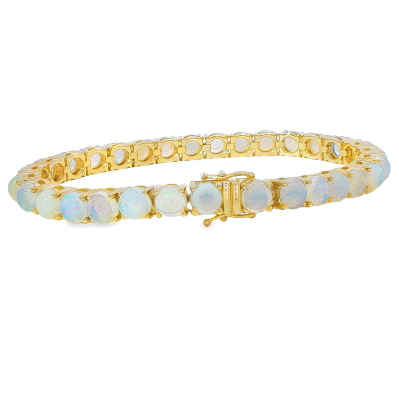 Yellow gold tennis bracelet with round opal gemstones and Gemini zodiac charm.