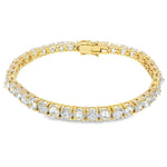 Yellow gold tennis bracelet with alternating upside-down round diamonds in secure clasp.