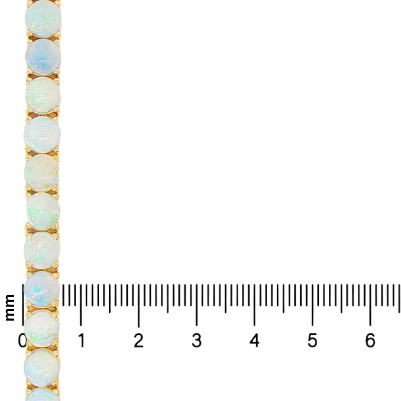 Gold tennis bracelet with round opal gemstones displaying blue and green flashes.