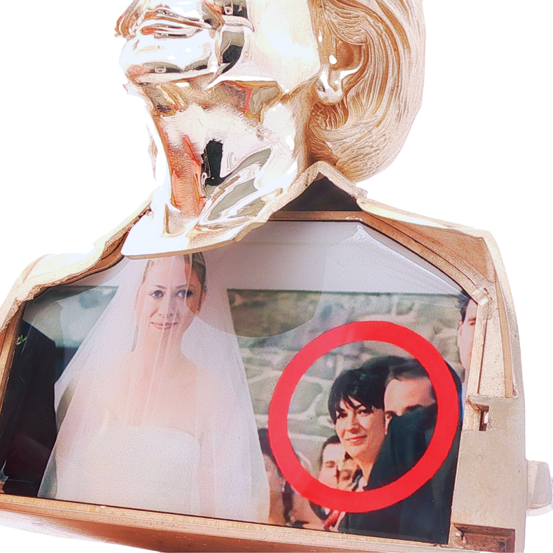 Gold-tone pendant featuring framed photo with red circle accent, polished smooth finish.