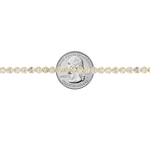 Yellow gold tennis chain necklace with round sparkling diamonds in a classic setting.