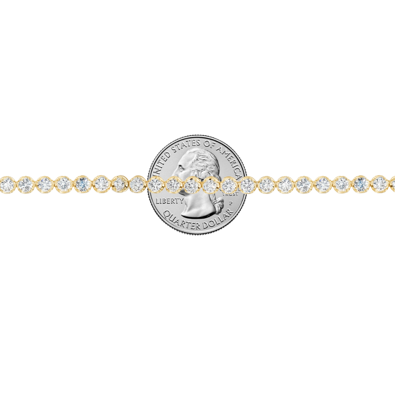 Yellow gold tennis chain necklace with round sparkling diamonds in a classic setting.