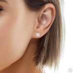 White gold clover cut diamond stud earrings with prong settings, elegant and sparkling.