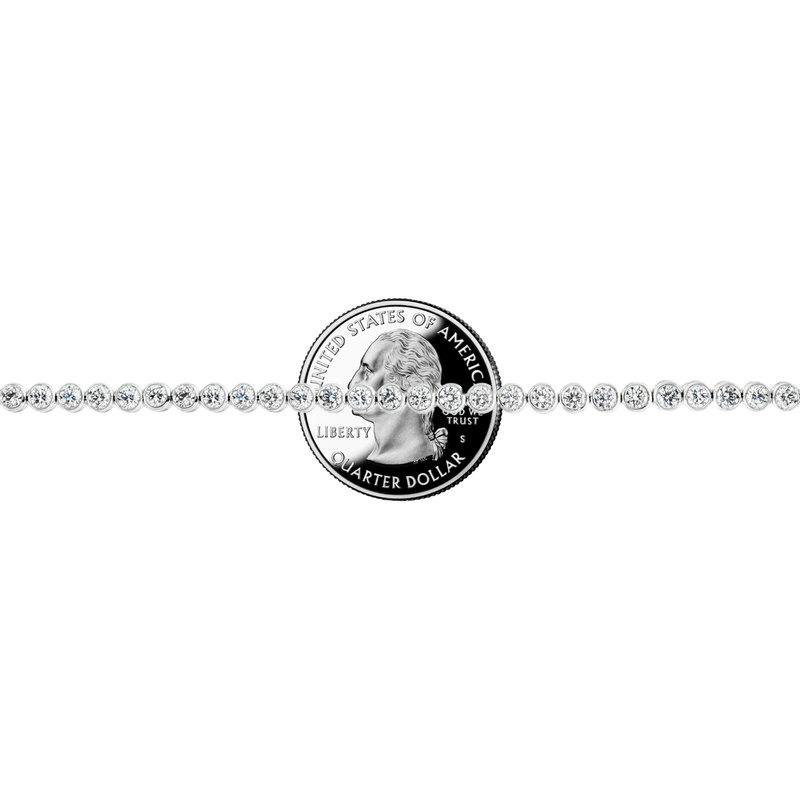 White gold bezel set tennis bracelet with round diamonds and secure clasp.