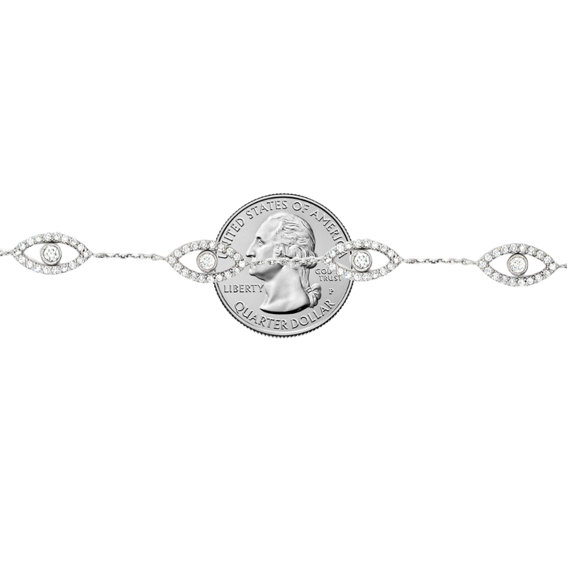 White gold evil eye bracelet with five diamond-accented eye charms and delicate chain links.