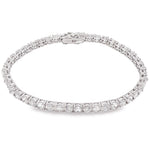 White gold tennis bracelet with alternating upside down round diamonds in a sleek setting.