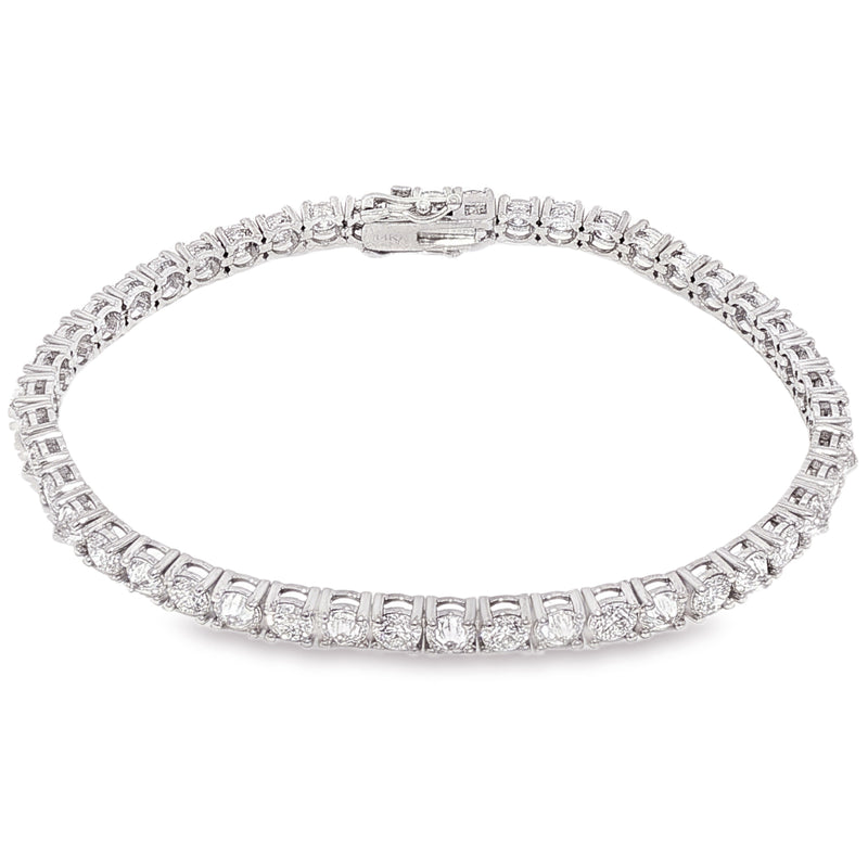 White gold tennis bracelet with alternating upside down round diamonds in a sleek setting.